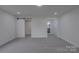 Spacious bedroom with carpet floor and access to the ensuite bathroom and closet at 116 11Th St, Spencer, NC 28159