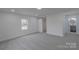 Bright bedroom boasts neutral walls, carpet flooring, and a sliding closet door at 116 11Th St, Spencer, NC 28159