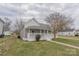 Charming single-story home with a covered front porch and manicured lawn at 116 11Th St, Spencer, NC 28159