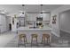 Modern kitchen with stainless steel appliances, island, and pendant lighting at 116 11Th St, Spencer, NC 28159