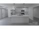 Contemporary kitchen with stainless steel appliances, white cabinetry, and a center island at 116 11Th St, Spencer, NC 28159