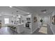 A bright, open kitchen with a large island, stainless steel appliances, and ample counter space at 116 11Th St, Spencer, NC 28159