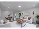 An open-concept living room featuring neutral tones, wood accents, and recessed lighting at 116 11Th St, Spencer, NC 28159