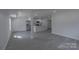 Open-concept living area features modern flooring, recessed lighting, and an island kitchen at 116 11Th St, Spencer, NC 28159