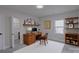 A bright office space with a wood desk, shelving, and natural light at 116 11Th St, Spencer, NC 28159