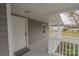 Inviting front porch view with a white door and ample space at 116 11Th St, Spencer, NC 28159