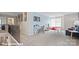 Upstairs loft featuring a blue accent wall, study area, and relaxed seating, creating a versatile living space at 120 Asmodean Ln, Troutman, NC 28166