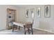 Bright office space featuring a wooden desk, stylish decor, and a bookshelf for storage and display at 120 Asmodean Ln, Troutman, NC 28166