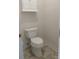 Toilet in a compact bathroom with a storage cabinet above at 1200 Craig Ave, Lancaster, SC 29720