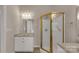 Bathroom features a walk-in shower, vanity, and ample lighting at 1200 Craig Ave, Lancaster, SC 29720