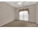 Bedroom with carpeted floors and a window with floral printed valance at 1200 Craig Ave, Lancaster, SC 29720