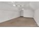 Spacious bonus room featuring neutral carpet, ceiling fans, and ample natural light at 1200 Craig Ave, Lancaster, SC 29720