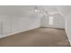 Large bonus room offering versatile space with neutral carpet, fan and natural light at 1200 Craig Ave, Lancaster, SC 29720
