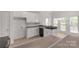 Well-lit kitchen features modern appliances, countertop space, and ample cabinetry for storage at 1200 Craig Ave, Lancaster, SC 29720