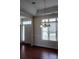 Bright living room area with hardwood floors, natural light, and chandelier at 1200 Craig Ave, Lancaster, SC 29720