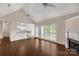 Bright living area flows seamlessly to the kitchen, offering views of the fireplace and backyard at 1200 Craig Ave, Lancaster, SC 29720