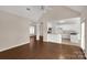 Spacious living room connects to the kitchen, features a ceiling fan, and offers abundant natural light at 1200 Craig Ave, Lancaster, SC 29720