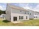 This image shows the back of the house, featuring a patio area and well-maintained backyard at 122 Asmodean Ln, Troutman, NC 28166
