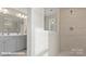 Modern bathroom features dual vanities, a large mirror, and a tiled walk-in shower at 122 Asmodean Ln, Troutman, NC 28166