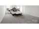 Carpeted bedroom with natural light, and two decorative benches at 122 Asmodean Ln, Troutman, NC 28166
