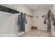 Walk-in closet features shelving and hanging space for ample storage at 122 Asmodean Ln, Troutman, NC 28166