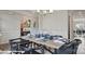 Elegant dining room with stylish chairs, set table, and view into a spacious living area at 122 Asmodean Ln, Troutman, NC 28166