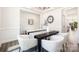 Dining room area featuring modern furnishings, hardwood flooring, and open to other rooms at 122 Asmodean Ln, Troutman, NC 28166