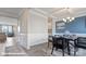 Inviting dining room showcasing a modern table setting and seamless flow into the adjacent living space at 122 Asmodean Ln, Troutman, NC 28166