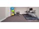 A residential gym features multiple treadmills, free weights, and fitness accessories for a complete workout experience at 122 Asmodean Ln, Troutman, NC 28166