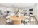 Open concept living space combining the kitchen, living room, and dining area in a seamless layout at 122 Asmodean Ln, Troutman, NC 28166