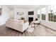 Bright living room with fireplace, hardwood floors and lots of natural light at 122 Asmodean Ln, Troutman, NC 28166
