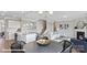 Open-concept living room with kitchen, dining area and fireplace, showcasing a modern and inviting design at 122 Asmodean Ln, Troutman, NC 28166