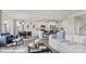 Open living space featuring seating area, dining table and bright modern kitchen with stainless appliances at 122 Asmodean Ln, Troutman, NC 28166