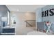 Bright loft area with plush carpeting, study space, and staircase access, perfect for a flexible living space at 122 Asmodean Ln, Troutman, NC 28166