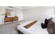 Main bedroom featuring decorative wall accents, carpet, and a seating bench at 122 Asmodean Ln, Troutman, NC 28166