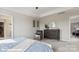 Serene bedroom boasts neutral colors, a ceiling fan, and a relaxing atmosphere at 122 Asmodean Ln, Troutman, NC 28166