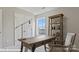 Well-lit office featuring a wooden desk and chair, with built-in shelving and a bright window view at 122 Asmodean Ln, Troutman, NC 28166