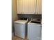 Convenient laundry room with built-in cabinets and modern washer and dryer at 1229 Mcgill Pond Ln, Rock Hill, SC 29732