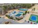 An aerial view shows the Highland Creek community pool, tennis courts, and playground at 12430 Kemerton Ln # 17, Huntersville, NC 28078