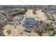 A beautiful aerial view shows community tennis courts, club house, a parking lot, and the course at Highland Creek at 12430 Kemerton Ln # 17, Huntersville, NC 28078