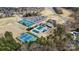 An aerial view of the community pool, tennis courts, clubhouse, and golf course at Highland Creek at 12430 Kemerton Ln # 17, Huntersville, NC 28078