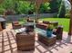 Outdoor patio with wicker sectional, lounge chairs, and coffee table underneath a wooden pergola at 12430 Kemerton Ln # 17, Huntersville, NC 28078