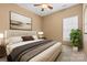 Cozy bedroom featuring neutral walls, natural light, and carpeted floors; the perfect retreat to relax and unwind at 12430 Kemerton Ln # 17, Huntersville, NC 28078