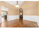 Dining room boasts elegant wainscoting and access to additional living spaces at 12430 Kemerton Ln # 17, Huntersville, NC 28078