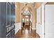 Inviting entryway with hardwood floors and arched doorways leading to the living room at 12430 Kemerton Ln # 17, Huntersville, NC 28078
