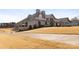 Stately home exterior and perfectly manicured lawn at 12430 Kemerton Ln # 17, Huntersville, NC 28078