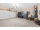 Spacious garage with epoxy flooring, organized storage cabinets, and ample space for parking and projects at 12430 Kemerton Ln # 17, Huntersville, NC 28078