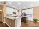 Modern kitchen featuring white cabinets, stainless steel appliances, and an island at 12430 Kemerton Ln # 17, Huntersville, NC 28078