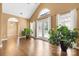 Spacious living room boasts a vaulted ceiling, large windows, and hardwood floors at 12430 Kemerton Ln # 17, Huntersville, NC 28078
