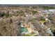 Aerial view showcases a serene, tree-lined neighborhood and lush landscapes at 13124 Lemmond Dr, Matthews, NC 28105